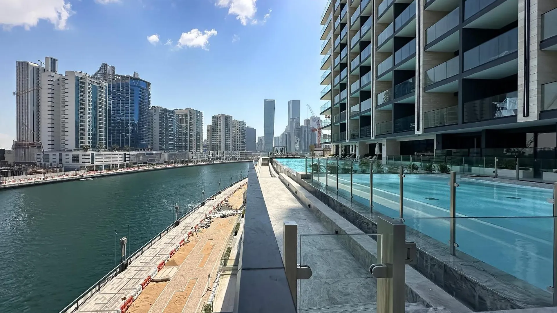 Elegant Getaway W Stunning Pool Canal Views Dubai Apartment